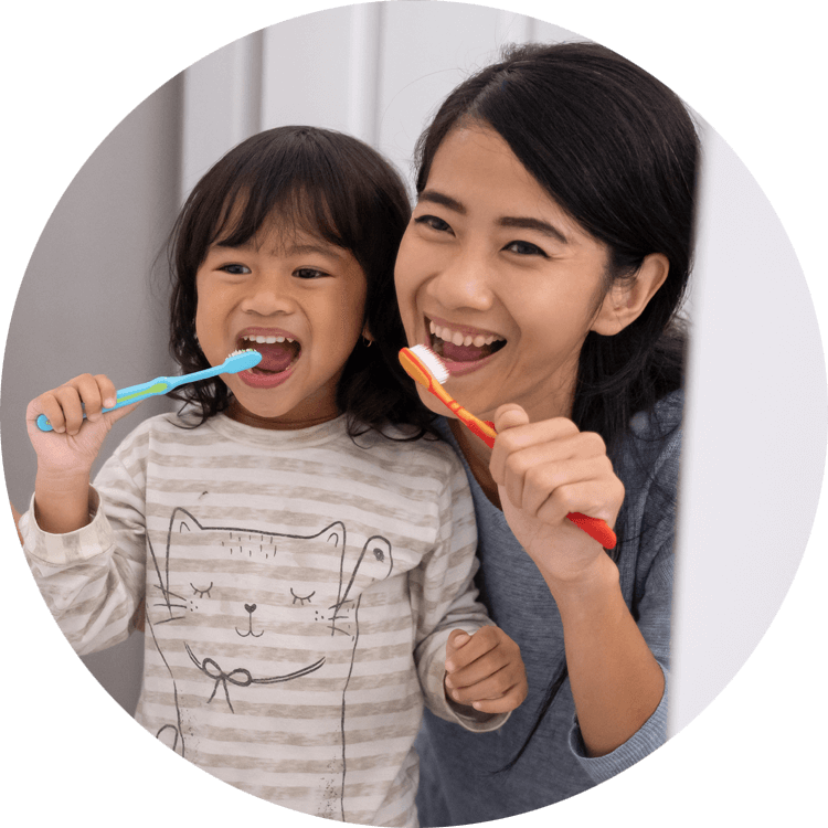 mom and kid brushing their teeth